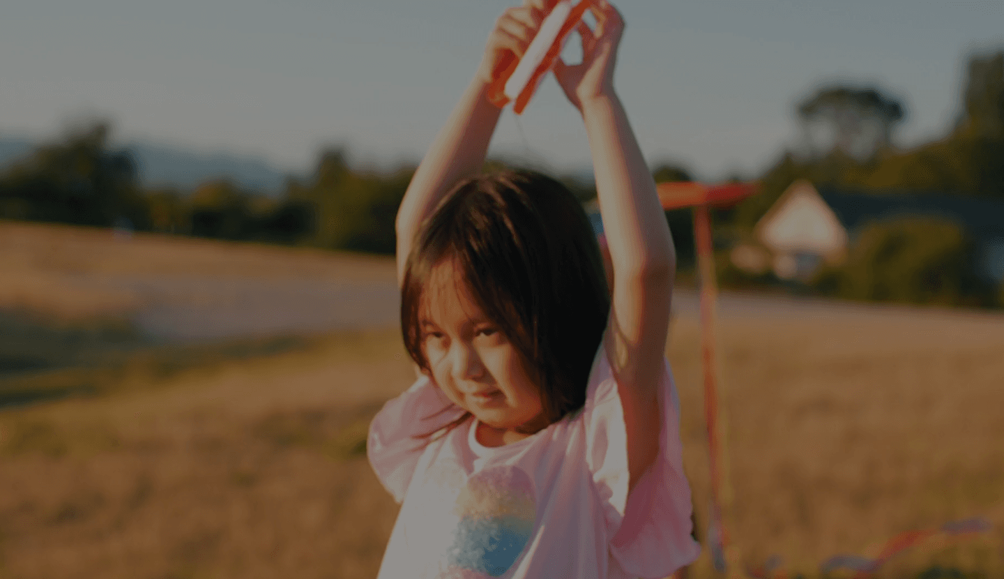 Children playing with a kite